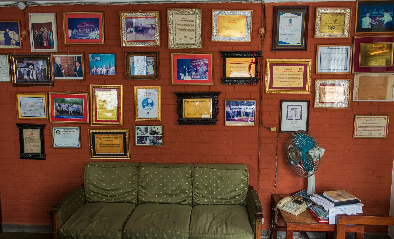 Muni Bahadur Sakya's office wall of certificates and awards